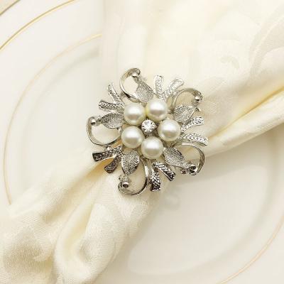 China Wholesale Elegant Metal Pearl Napkin Rings In Ivory And Gold Napkin Ring Holder For Restaurant for sale