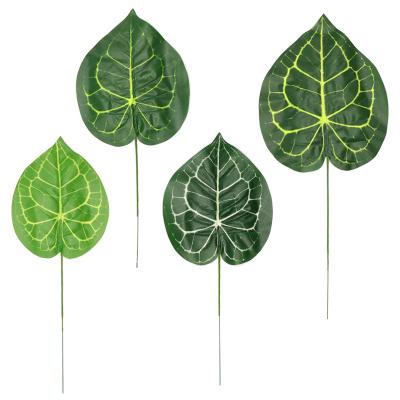 China Artificial plastic modern wedding decoration party monstera leaf branch leaf palm leaf for sale