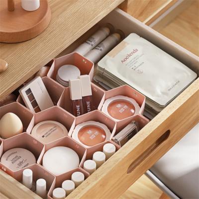 China Creative Eco-Friendly Household Hierarchical Storage Honeycomb Form Drawer Dividers Plastic Organizer for sale