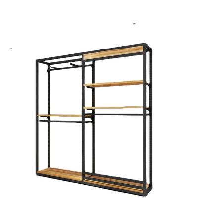 China Product Showcase European Style Advanced Wooden Stainless Steel Clothing Display Rack for sale