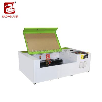 China Shandong Julong Small Laser 40W CO2 Water Cooled Laser Engraving Cutting Machine 40w Lazer Cutter Engraver for sale