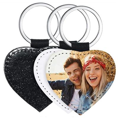 China Sublimation Masks 2021 New Gift Sublimation Masks Black Heart Shape Glitter PU Sublimation Keychains for sale