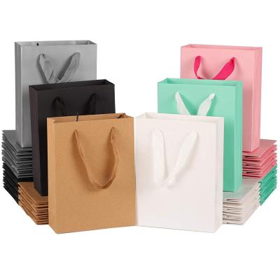 China Gift Packaging Custom Logo Luxury Kraft Shopping Paper Bag With Handles for sale