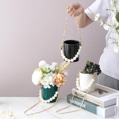 China New Design Home Minimalist Wall Decor Ceramic Hanging Pots For Indoor Plants for sale