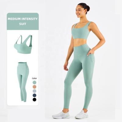 China Activewear Sports Yoga Sports Breathable Two Piece Bra Crop Top Size High Tops Womens Equipments Gym Fitness Sets Tights Gaiters With Pockets for sale