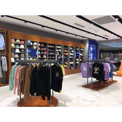 China Retail Sports / Sports Clothing Store Clothes Store Shelves Gold Color Clothing Display Rack Customizable Metal Racks For Shops for sale