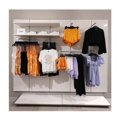 China Retail / Sports Clothing Store Display Wall Modern Design Clothing Racks For Garment Store Luxury Clothing Store Interior Design for sale