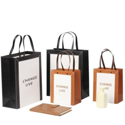 China Recycled Colorful Printing Materials Handle Bag Paper Packaging Custom Bag With Printing Logo Ribbon Handle for sale