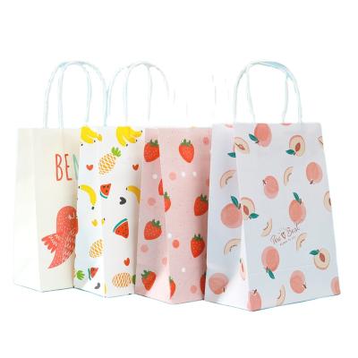 China Recycled Materials Wholesale White Cartoon Pattern Print Holiday Party Gift Wrapping Paper Bag With Handle for sale