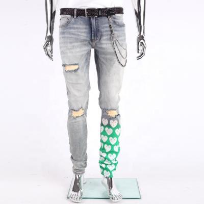 China Custom Viable Newcomers Light Blue Washed Hole Printed Vintage Used Skinny Ripped Jeans For Men for sale