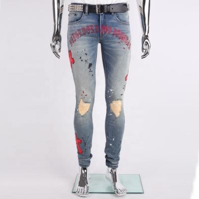 China Fashion viable 2022 rhinestone denim crossover leather edge patch splash paint distressed men's crossovers skinny jeans for sale