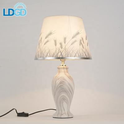 China Modern Decorative Smart Office Ceramic Fabric Light Modern Led Hotel Bedroom Bedroom Table Lamp for sale