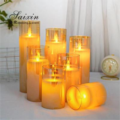 China Hot sale  wedding  decoration real wax flicke moving flame LED pillar candle with glass cups zu verkaufen