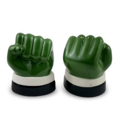 China Viable Ceramic Salt and Pepper Shakers in Fist Funny Salt and Pepper Fist Shakers Shape Handpainting of Dolomite Salt and Pepper Cave for sale