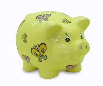 China Swine Coin and Money Money Saving Bank in Yellow with Ceramic Butterfly Pig Savings Bank with Decal Handpainting Dolomite Swine Coin Bank for sale