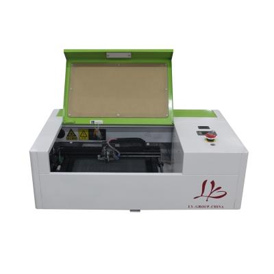 China Laser Engraving 40W Mini Laser Cutter LY 3020/2030 CO2 Laser Engraving Cutting Machine With LCD Control Panel Working Size 300x200mm for sale