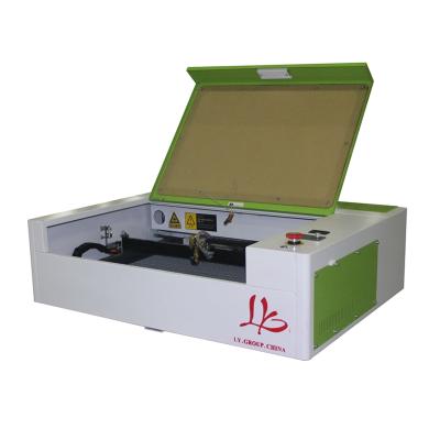 China Laser Engraving 5030 CO2 40W Laser Engraving Cutting Machine with LCD Control Panel and Honeycomb Board USB Port 500*300mm for sale