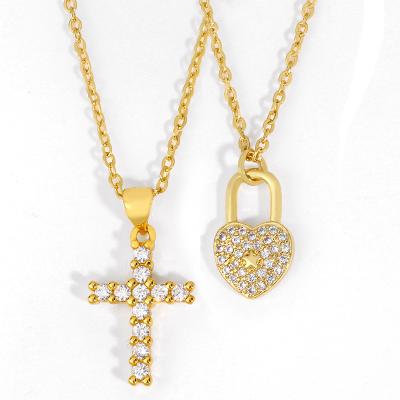 China 2021 FASHIONABLE Mens Womens Hip Hop Lock Heart PONEES Striker Cross Pendant Necklaces for sale