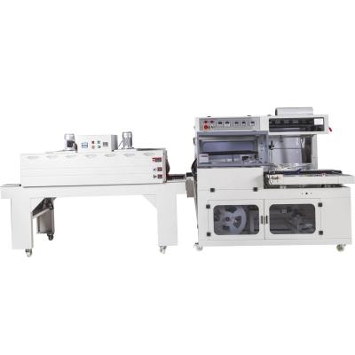 China Full Automatic Pe Film Fresh Vegetable Tray Wrap Packing Food Over Wrapping Machinery Shrink Sleeve Cutting Machine for sale