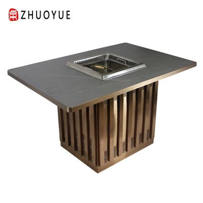 China Modern hot sale hot pot equipment smokeless hot pot equipment rock dish for restaurant hot pot table for sale