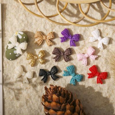 China Popular Resin Material Eco-friendly Popular Resin Girl Heart Nail Bow Multicolor Stereo Decoration Bow Nail Decoration Japanese Style for sale