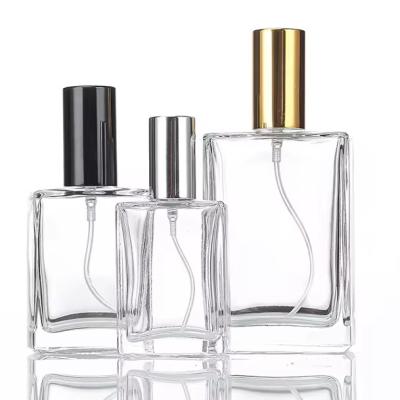 China Cosmetic wholesale Refillable Empty transparent 30ml 50ml 100ml Thick Bottom Square Glass Perfume Bottles with Lids for sale