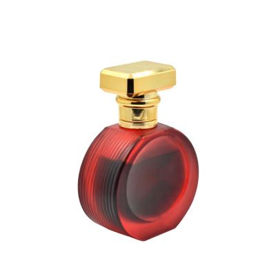 China Order-Performing Spray Coating Red Oblate Shaped Perfume Bottle With Aluminum Lid For Perfume Oil Glass Bottle for sale