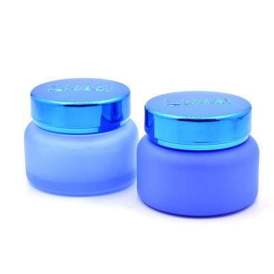 China Wholesale Color Cosmetic Blue Liner Empty Glass Jar For Skin Care Cream Emboss Logo Glass Jar for sale