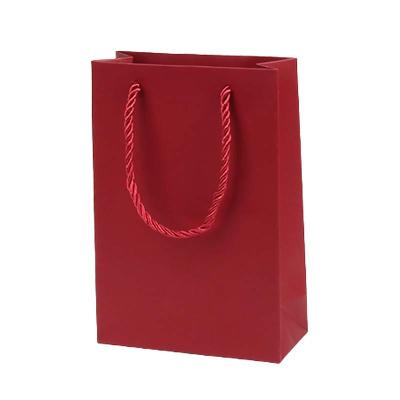 China PVC Low Price Promotion Cardboard Material Small Jewelry Bag Solid Color Goods Gift Bag for sale