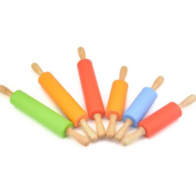 China Amazon Food Grade Kids Cure Tool Silicone Mini Rolling Pin With Wooden Viable Hot Selling Handle for sale