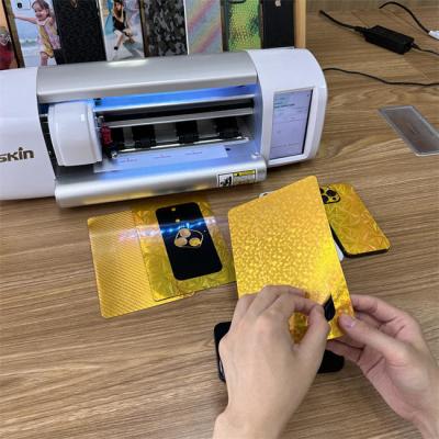 Chine L'or 3d mobile a gravé la peau en refief avec la découpeuse de peau de téléphone portable pour l'autocollant faisant des affaires à vendre