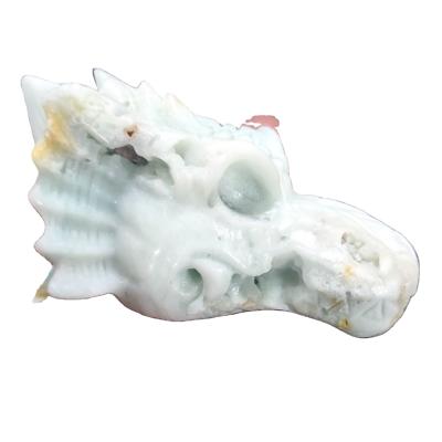 China Wholesale Europe Natural Stones Ocean Jasper Dragon Crystal Carving Skull For Decoration for sale