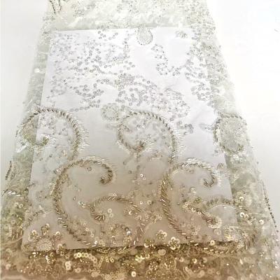 China New Large 3d Flower Luxury High Quality French Breathable Mesh Beaded Sequin Embroidery Lace Heavy Nigerian Bridal Fabric For Wedding Dress for sale