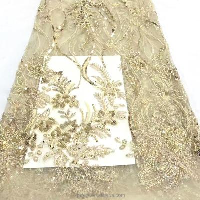 China Shaoxing upper end breathable plant and flower design light champagne sequin embroidery lace wholesale beaded fabric for sale