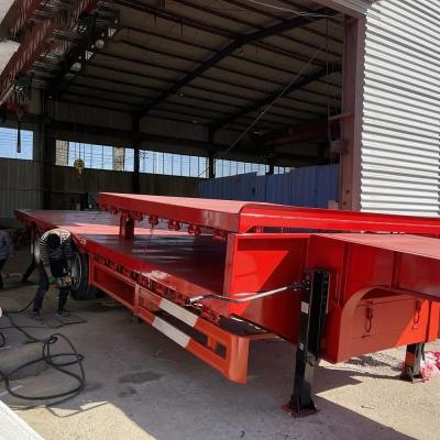 China Flatbed Truck Trailers for 20ft 40ft 45ft Containers 100ton 3 Axle Extendable Semi Trailer for sale