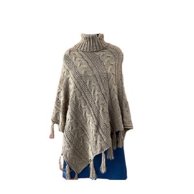 China HOT FEELING READY TO SHIP WHOLE SALE WOMEN ONE SIZE 100% ACRYLIC CABLE SWEATER PONCHO WITH TASSELS for sale