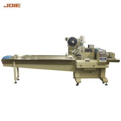 China Food Three Servo Chocolate Flow Packing Machine Small Plastic Candy Packing Machine / Date Packing Machine for sale