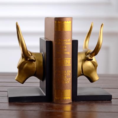 China New Design Bull Bookends Resin Head Gold Plated Cow Head Bookends Retro Home Furnishing Ornament for sale