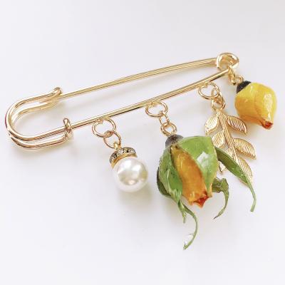 China Resin Pin Real Dried Rose Fancy Handmade Gold Flower Brooch for sale