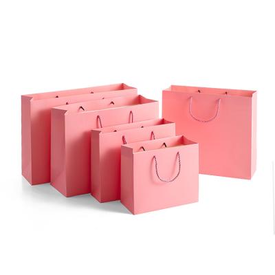 China Pink Recyclable Wholesale Paper Bags White Custom Gift Paper Bag With Handle Clothing Shoe Shopping Luxury Packaging Paper Bag With Logo for sale