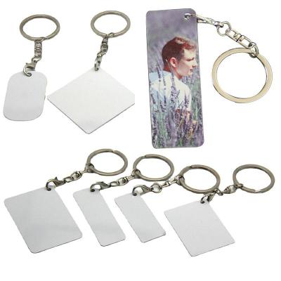 China Cheap Custom Double Side Sublimation Mute Key Chain Metal Eco Friendly 2D Around Logo Sublimation Keychain for sale