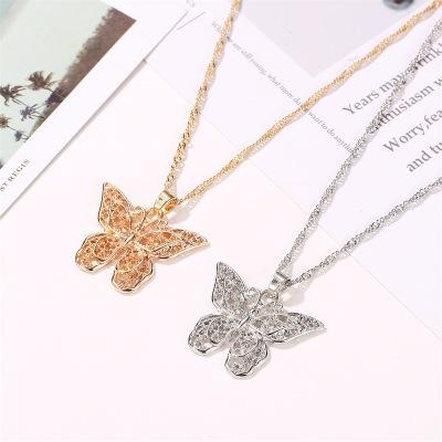 China Fancy Metal Hollow-out Shape Metal Necklace Girls Gold Butterfly Pendant Necklace for sale