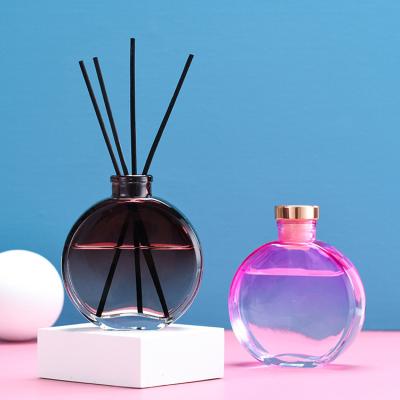 China Customization 150ml Personal Care Decorative Round Pole Flattened Colored Glass Reed Diffuser Bottle Wholesale Perfume for sale