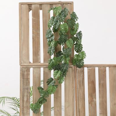 China Hot-selling simulation natural touch back plant turtle leaf rattan wall green plant leaf wedding home decoration for sale