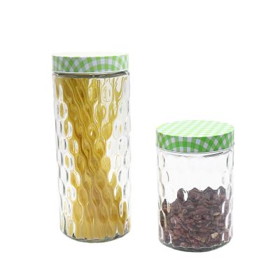 China Transparent Unique Embossed Glass Freshness Storage Storage Jar With Metal Lid for sale