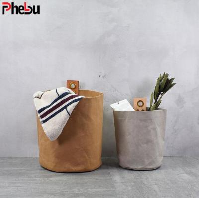 China Eco-Friendly Multifunctional Round Bottom Washable Kraft Paper Toy Grocery Storage Bag Sustainable for sale