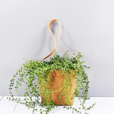 China Sustainable Green Field Recyclable Cloth Hanging Washable Kraft Paper Storage Bag for sale