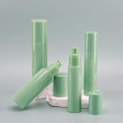 China Green PET Cosmetic Packaging Empty PP Cosmetic Bottle Round With Pump Head for sale