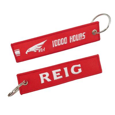 China Wholesale Customized iron on luggage tag label patch embroidery keychain flight for logo woven keychains for sale