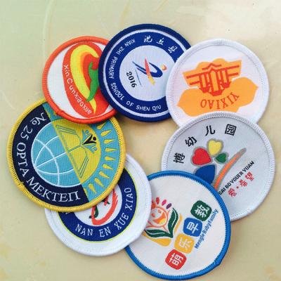 China Wholesale New Design Woven Badge Patch Badge High Density Merrow Nickel Free Sew On Embroidered Badge For Clothing for sale